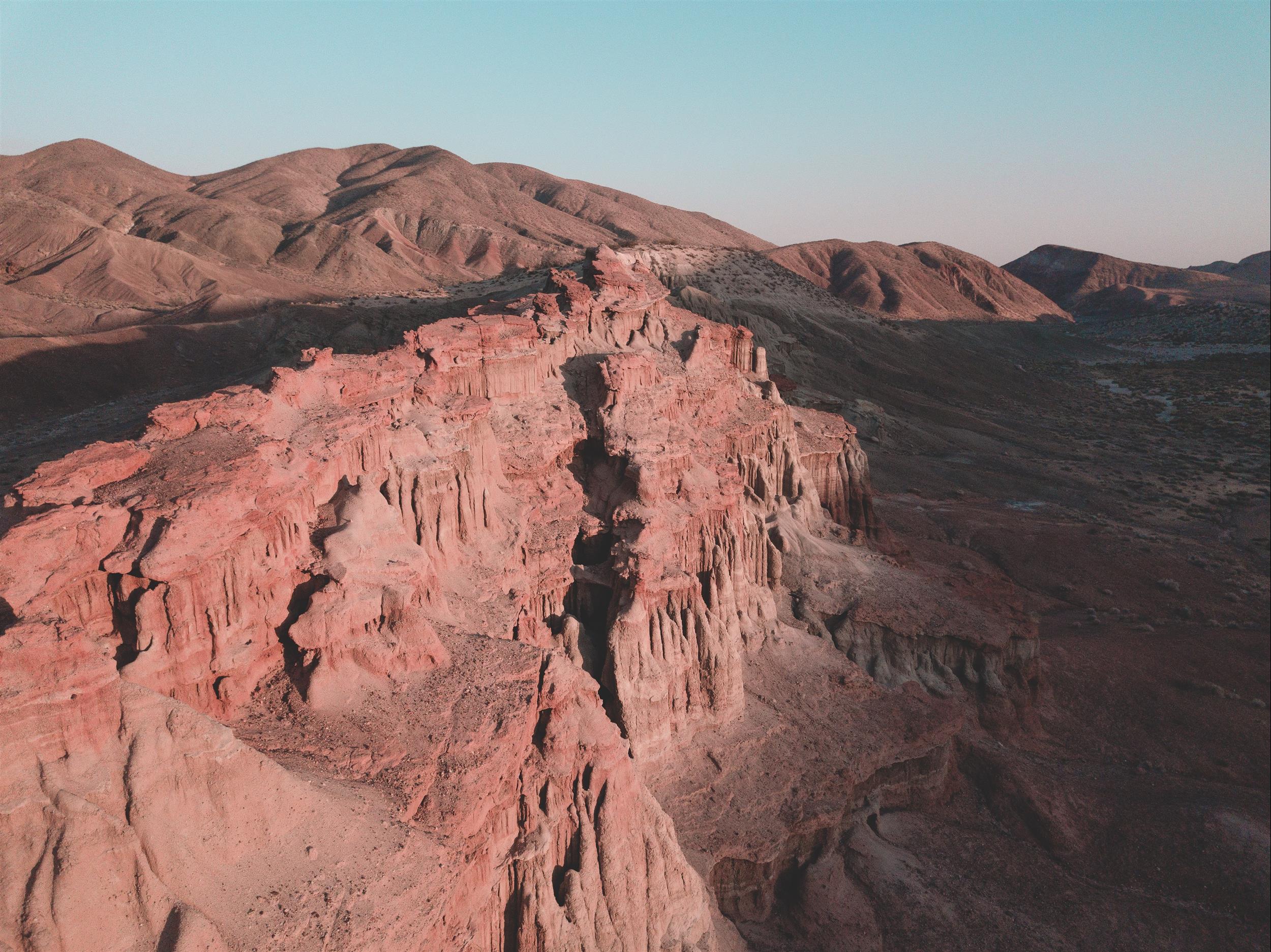 A areil view of a desert mountains..