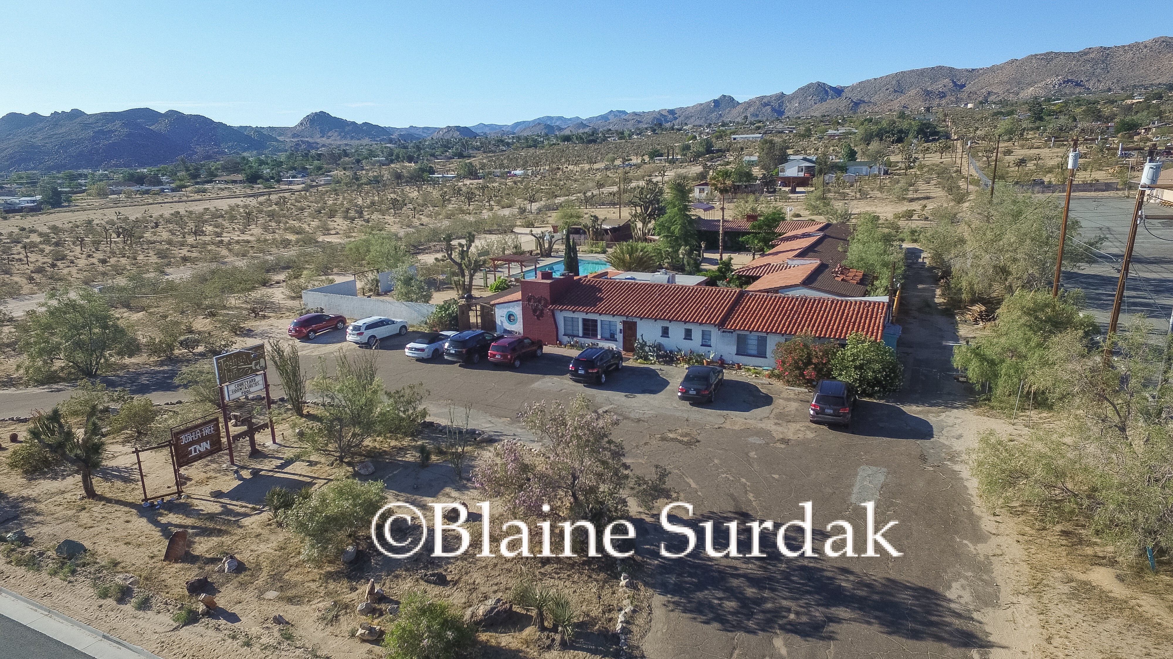 An ariel view of the inn and its parking lot.